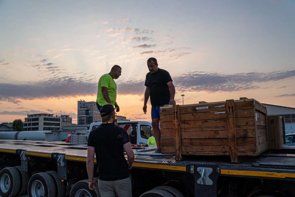 Helicopter fuselage on specialized hauling vehicle