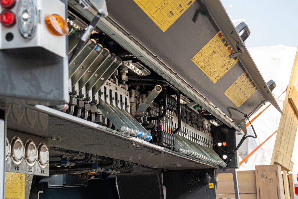 Wind turbine blade hauled on multi-axle transport at night